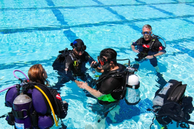 Dive Instructor and students in pool